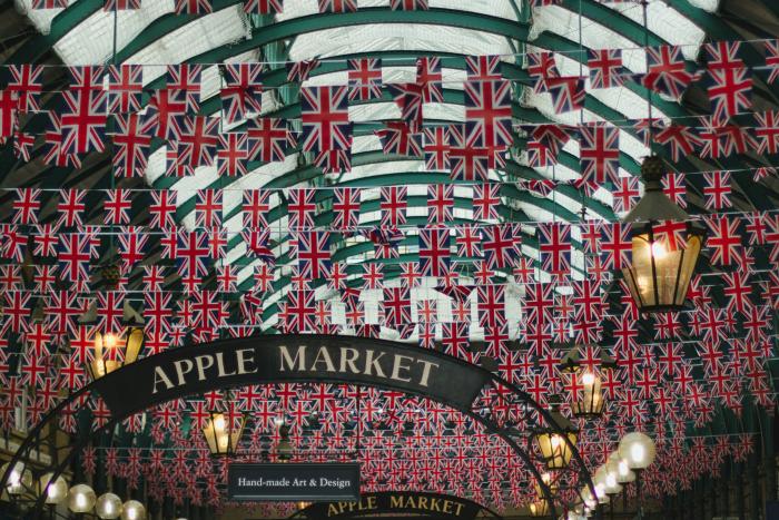 An apple market covered with hundreds of British Flags